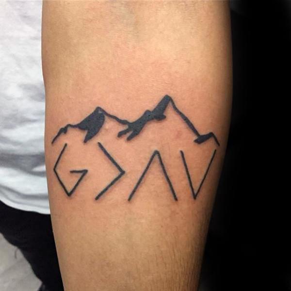 god is greater than the highs and lows with mountain tattoo