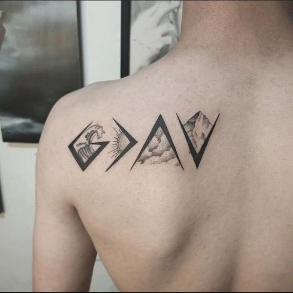 god is greater than the highs and lows with wave sun cloud and mountain tattoo shoulder blade