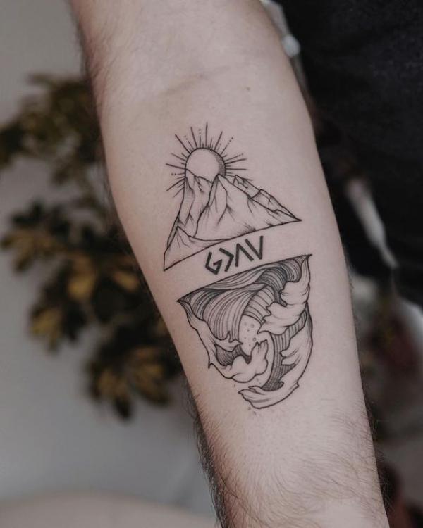 god is greater than the ups and downs with mountain sun and wave tattoo