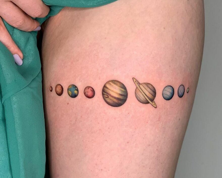 Planets thigh tattoo