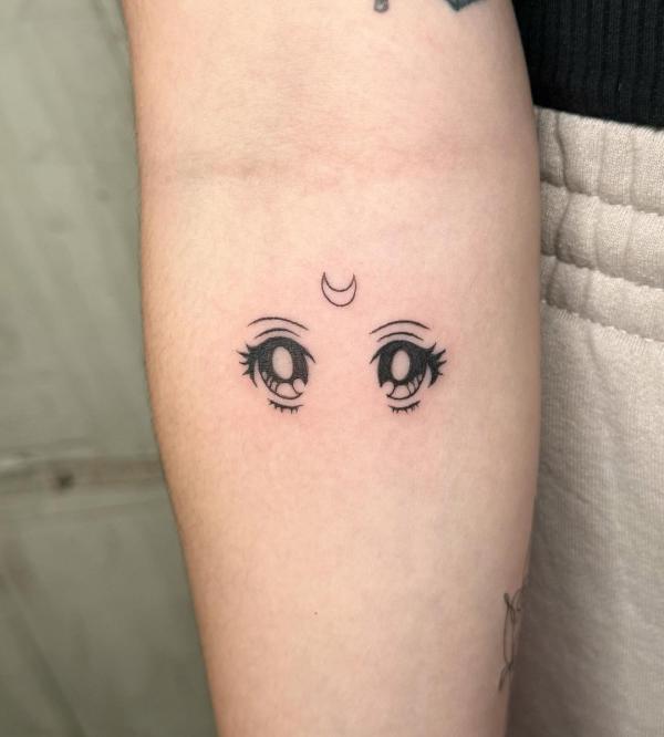 sailor moon eyes tattoo below inner elbow