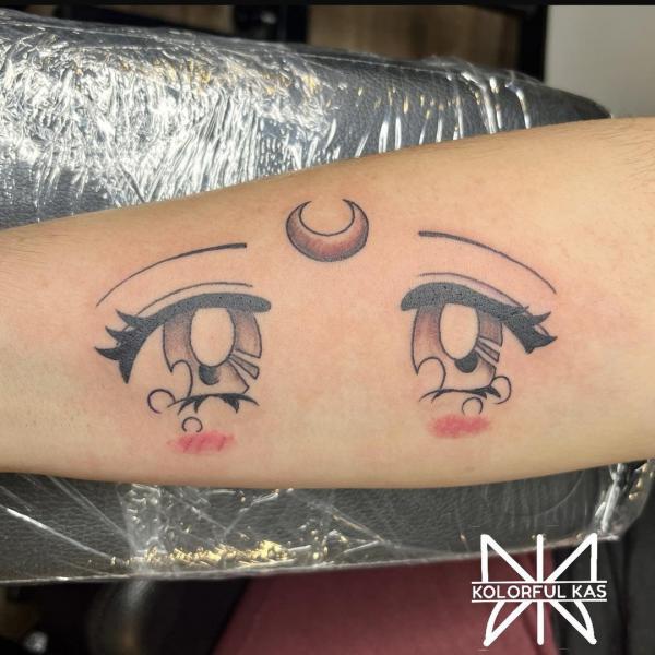 sailor moon eyes tattoo forearm