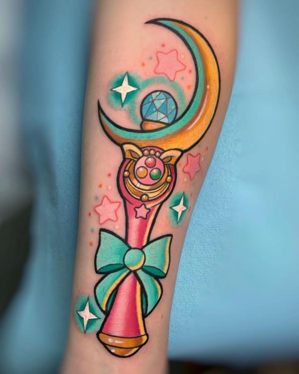 sailor moon wand with bow and stars tattoo