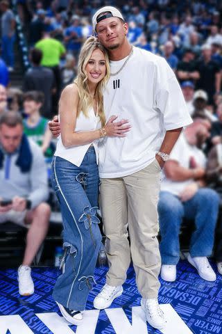 <p>Brittany Mahomes/Instagram</p> Brittany Mahomes poses with husband Patrick Mahomes at the NBA playoffs.