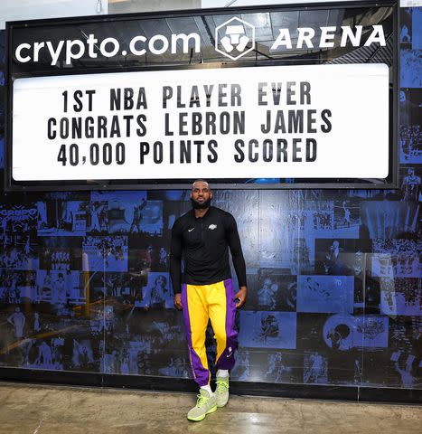 <p>Jim Poorten/NBAE via Getty Images</p> LeBron James celebrates scoring 40,000 points