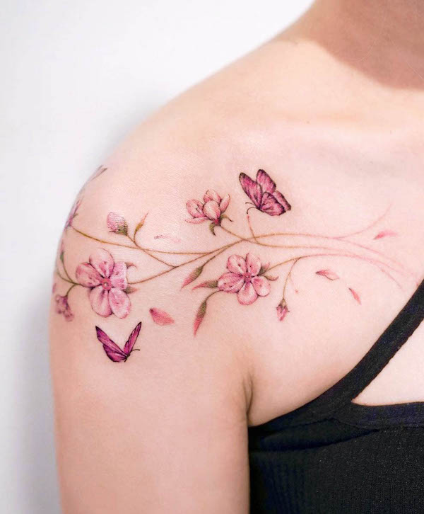 Cherry blossom branches and butterflies tattoo by @o.ri_tattoo