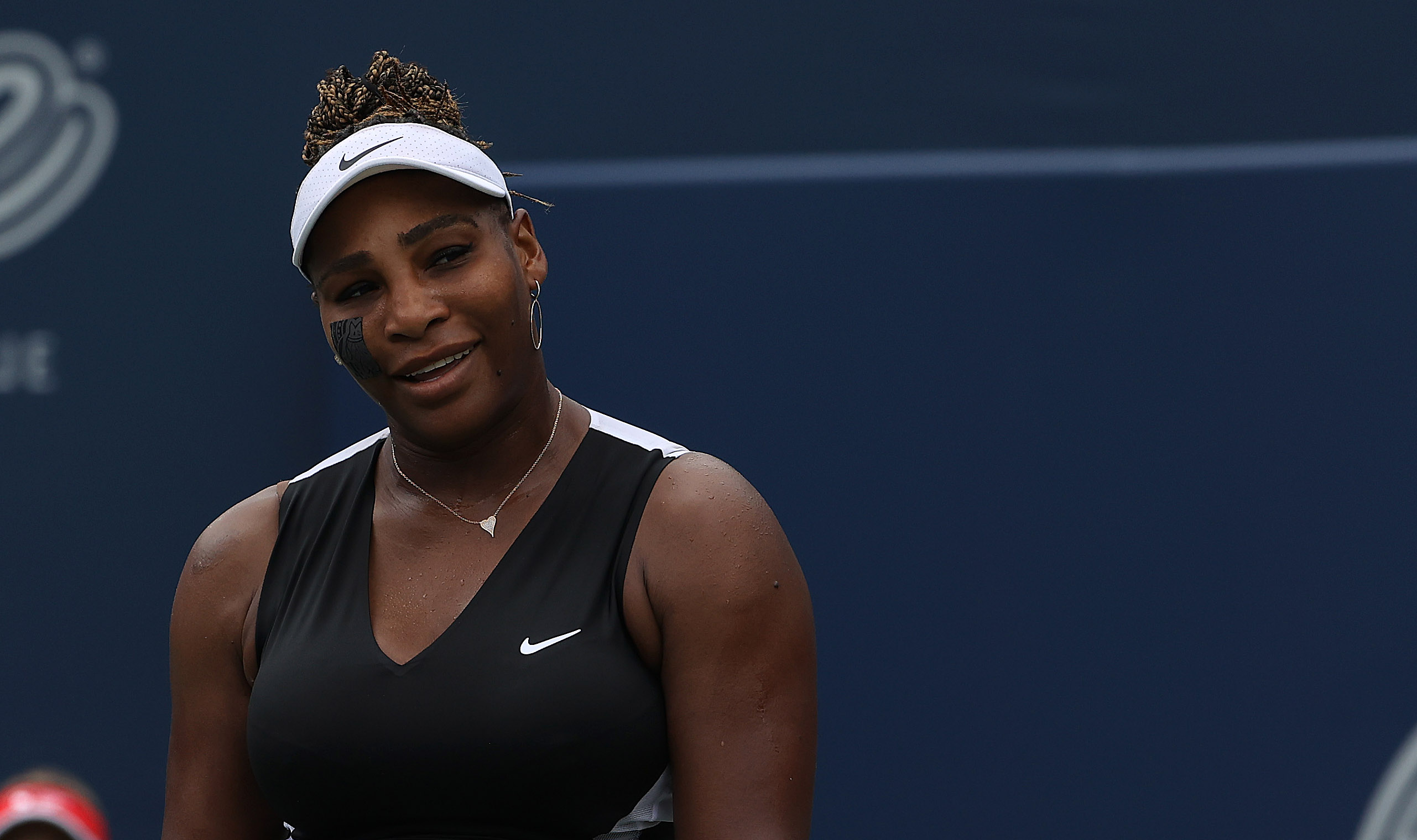 Serena Williams takes a moment to laugh after defeating Nuria Parrizas Diaz on Centre Court at York University in Toronto on August 8, 2022.