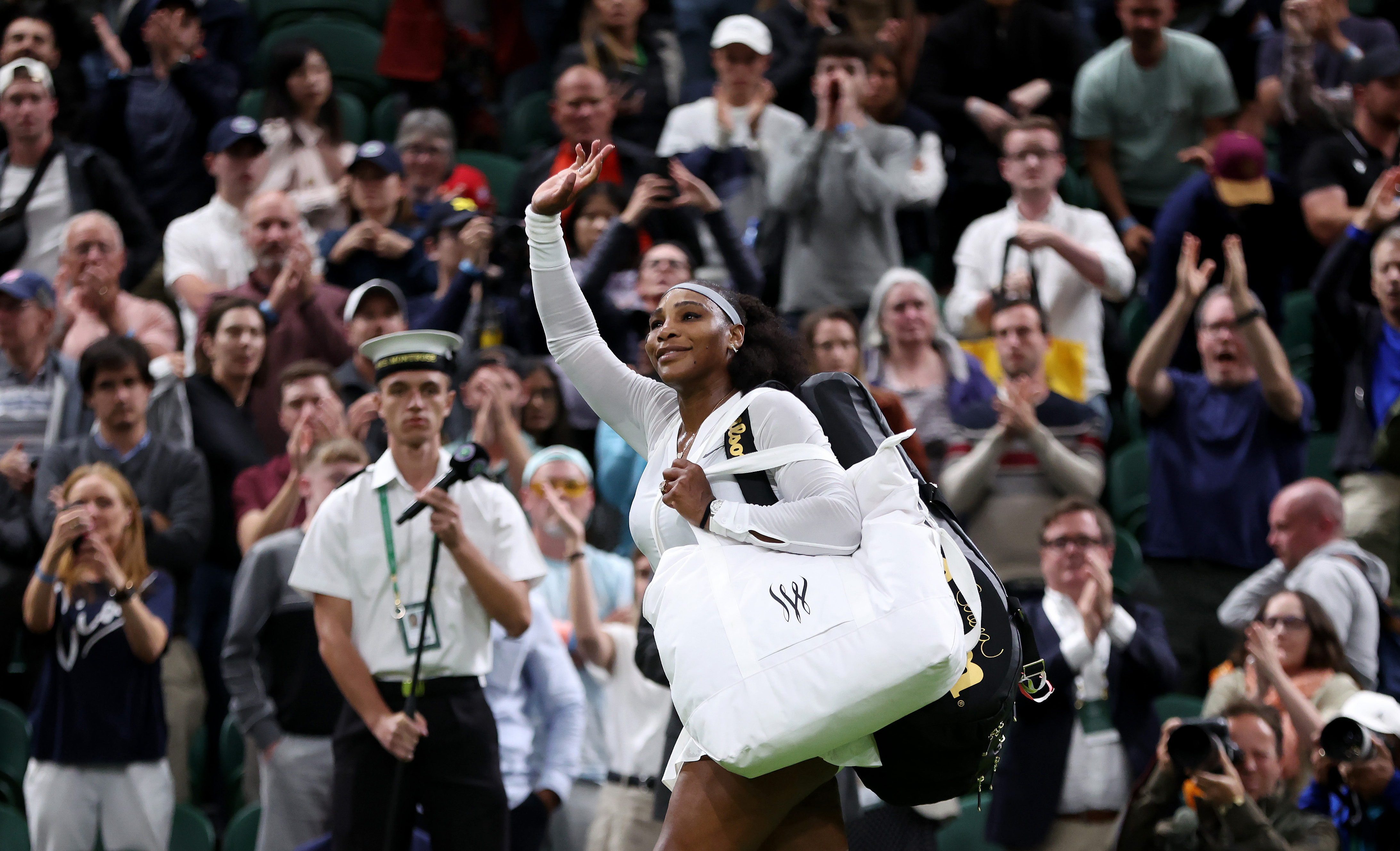 Serena Williams waves to the crowd after her Women's Singles First Round Match on day two of The Championships Wimbledon 2022 on June 28, 2022 in London.