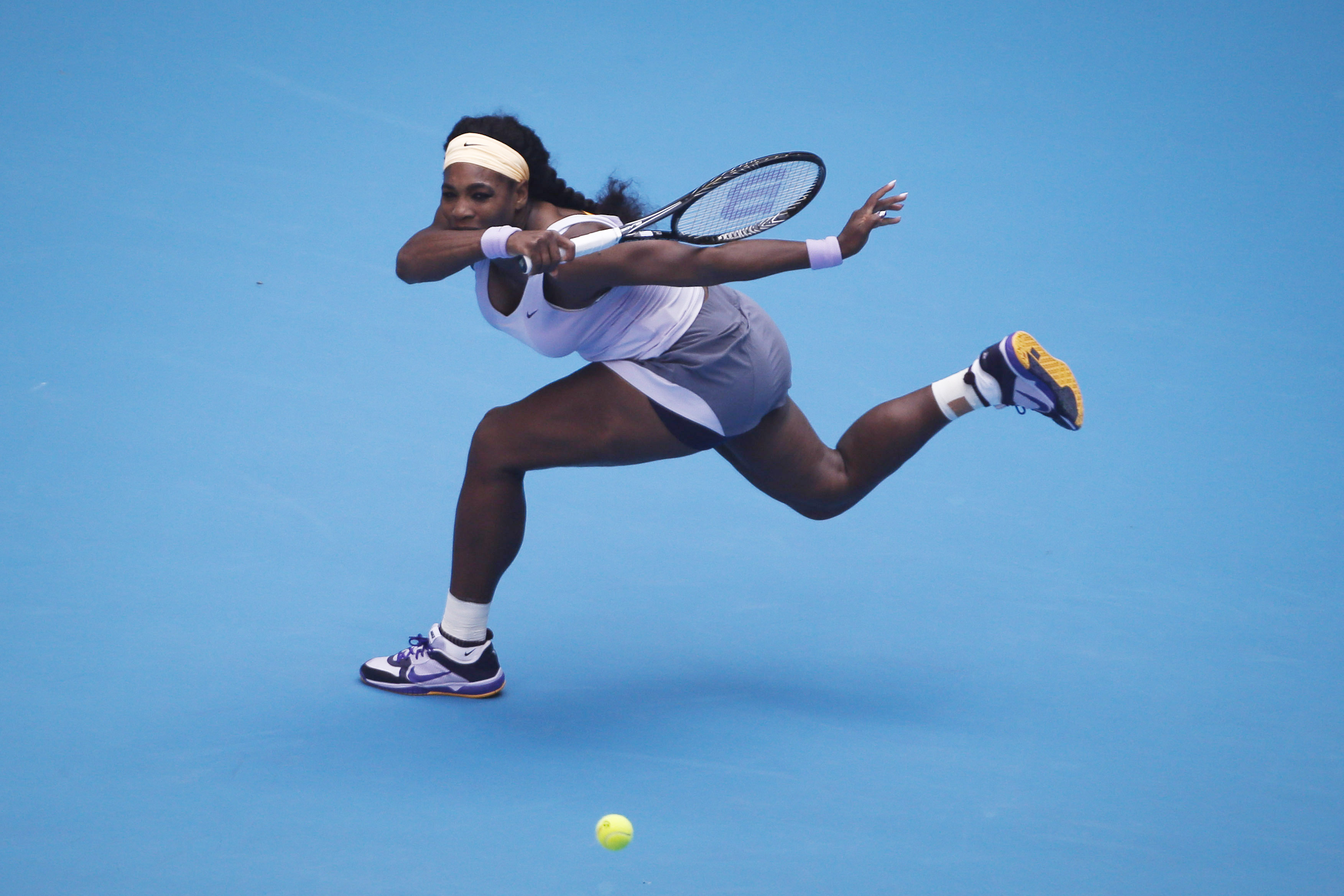 Serena Williams makes an effort to return a ball during the 2013 China Open at National Tennis Center on October 3, 2013, in Beijing, China.