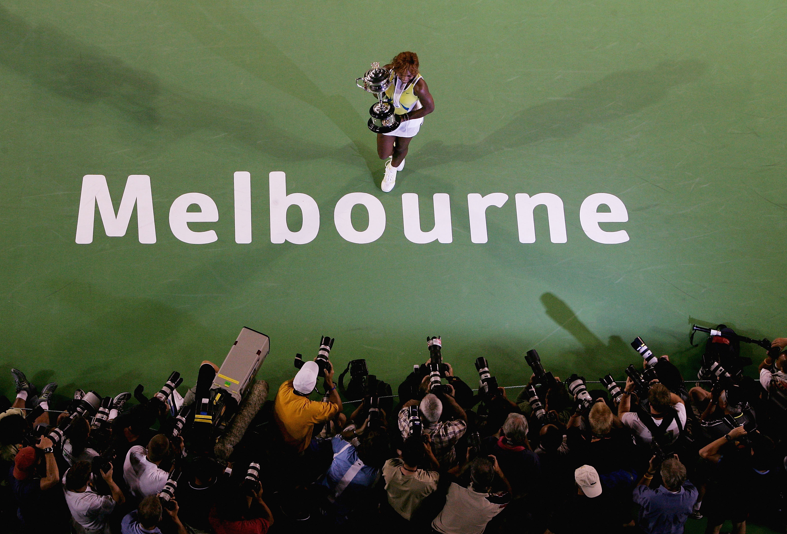 Serena Williams presents her trophy to the crowd after winning the Women's Final during the Australian Open Grand Slam at Melbourne Park on January 29, 2005.