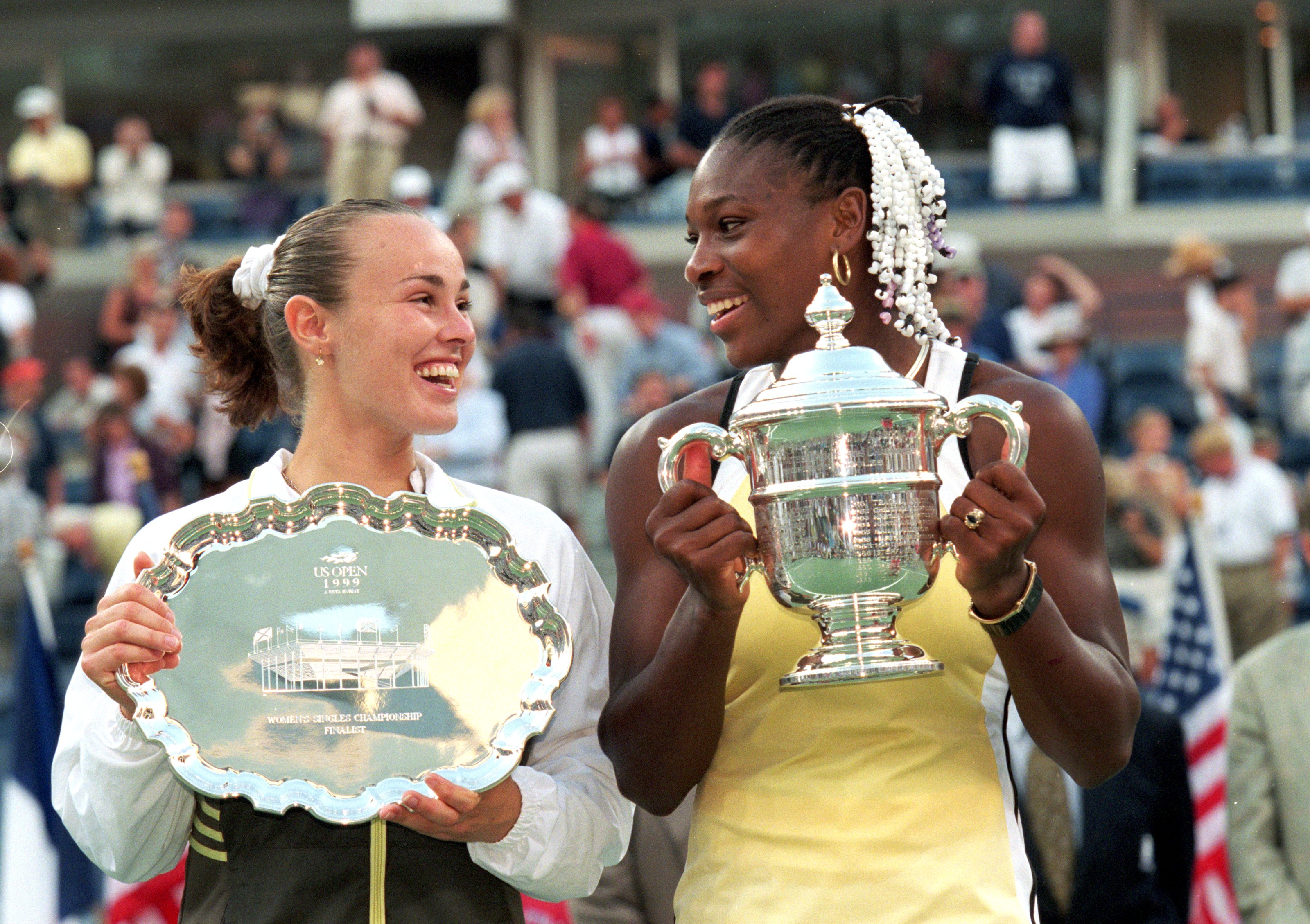 Serena Williams wins her first grand slam singles title against Martina Hingis of Switzerland (right), as they pose together with their trophies after their match in the US Open at the USTA National Tennis Center on Sep. 11, 1999.