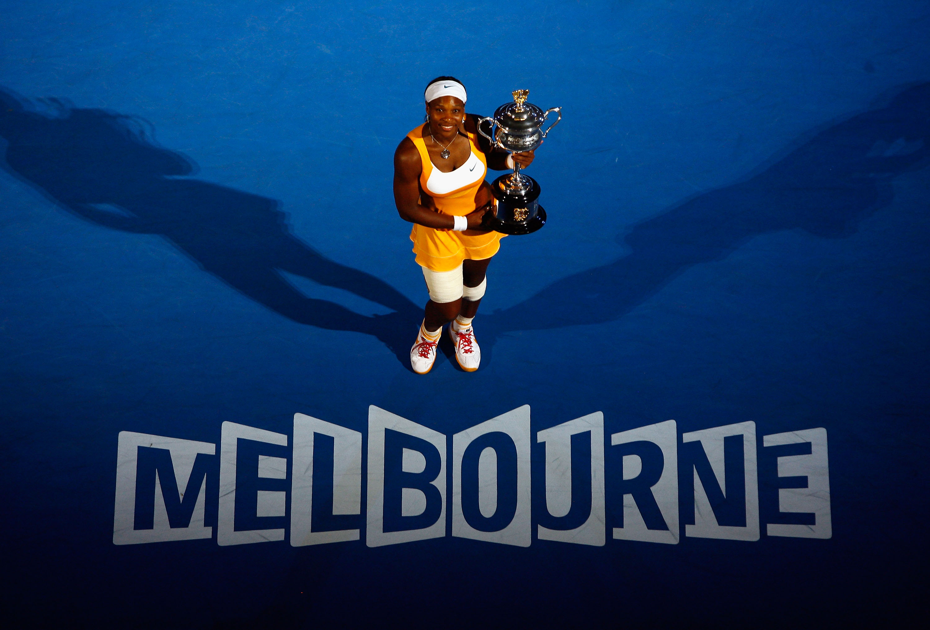 Serena Williams poses with the Daphne Akhurst Trophy after winning her women's final match against Justine Henin at the 2010 Australian Open at Melbourne Park on January 30, 2010, in Melbourne, Australia.