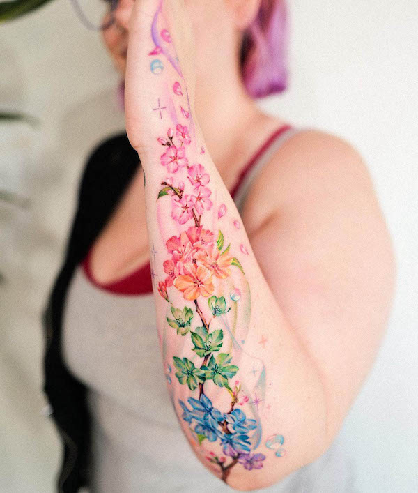 Rainbow cherry blossom tattoo by @guseul_tattoo