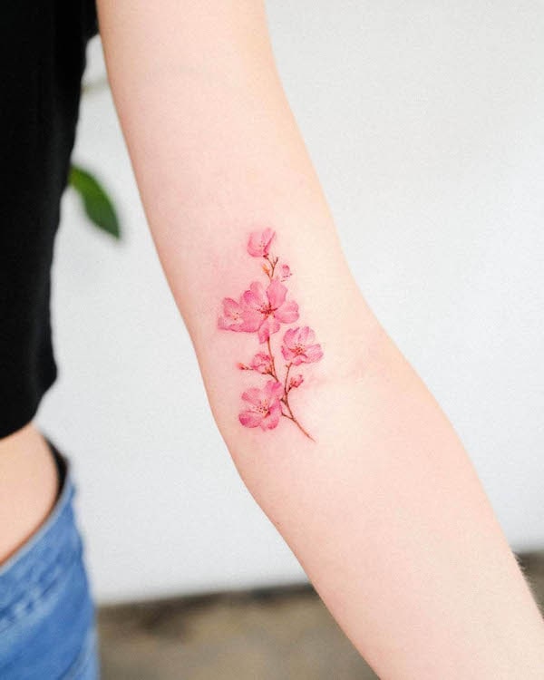 Small cherry blossom arm tattoo by @guseul_tattoo