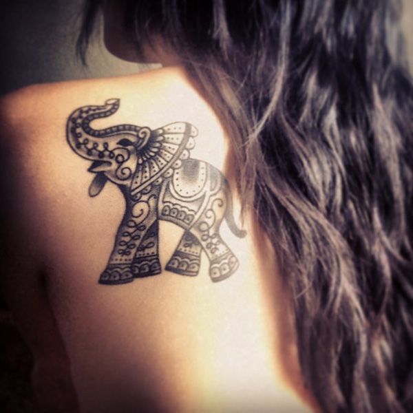 Photo of elephant tattoo on female shoulder