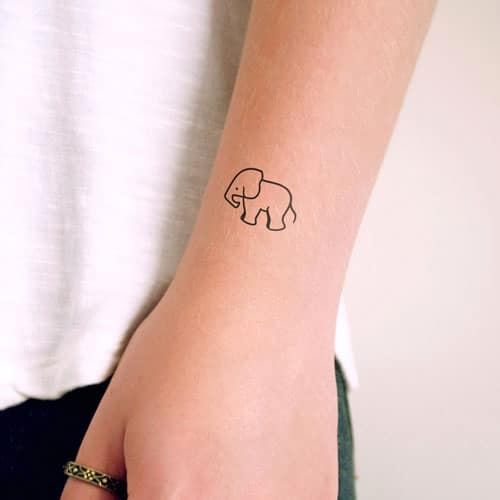 Tiny mini elephant tattoo on hand