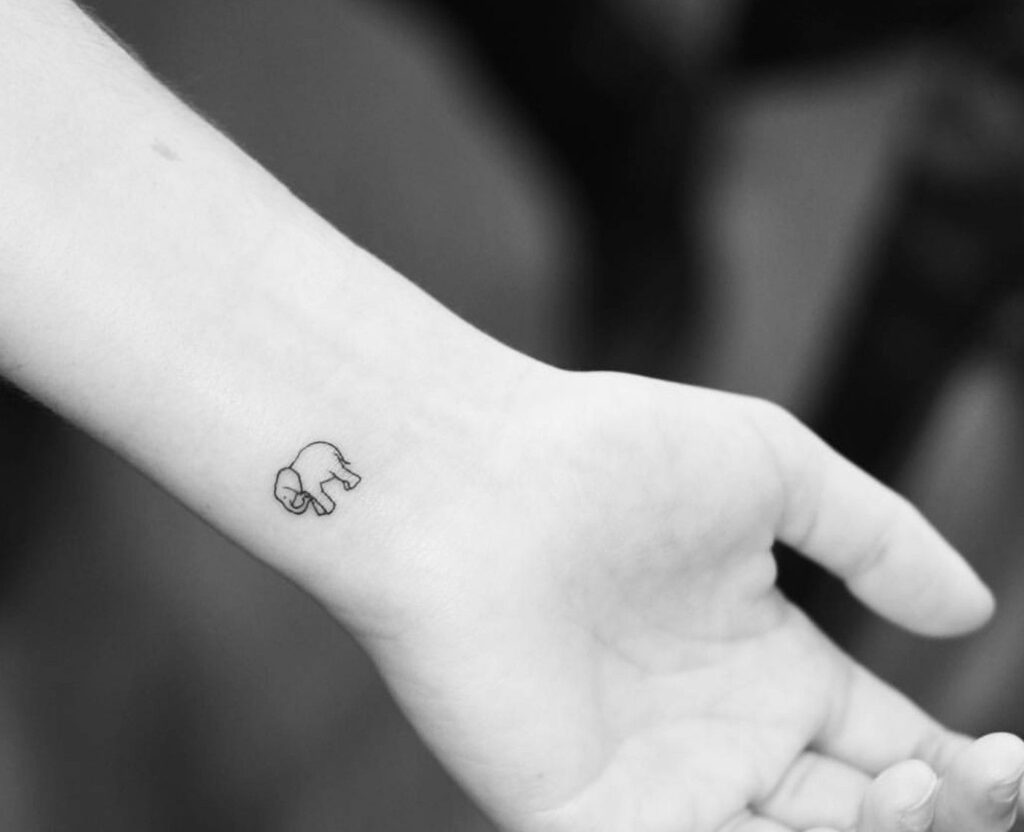 Cute mini elephant tattoo on wrist