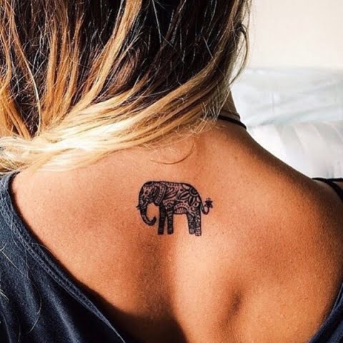 Beautiful mini elephant tattoo on the back of the neck
