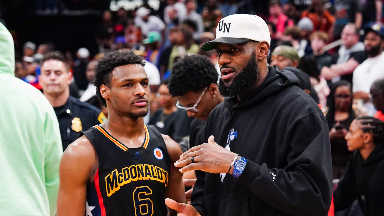 Bronny James talks to LeBron after the 2023 McDonald's High School Boys All-American Game. (Photo by Alex Bierens de Haan / GETTY IMAGES NORTH AMERICA / AFP)