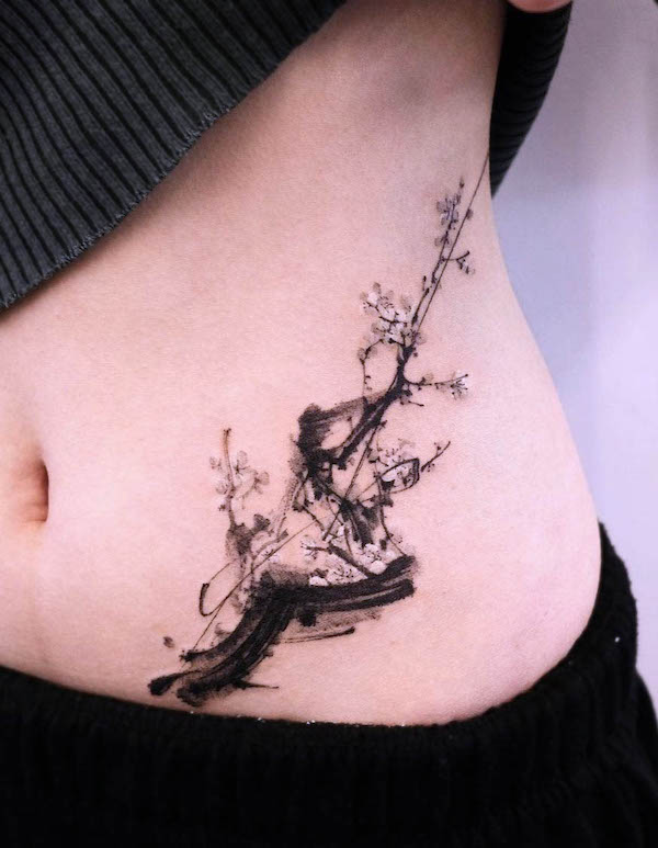 Black cherry blossom waist tattoo by @tattooist_soma