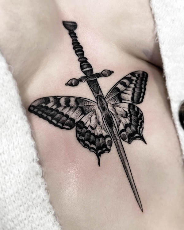 Butterfly and sword underboob tattoo by @hipner.magdalena