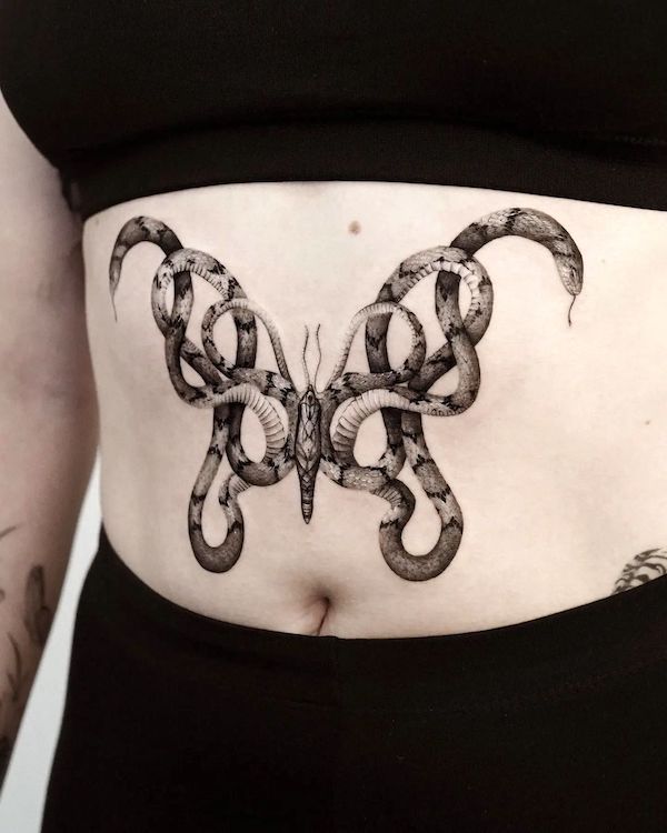 Moth snake sternum tattoo by @jamjam.tattoo