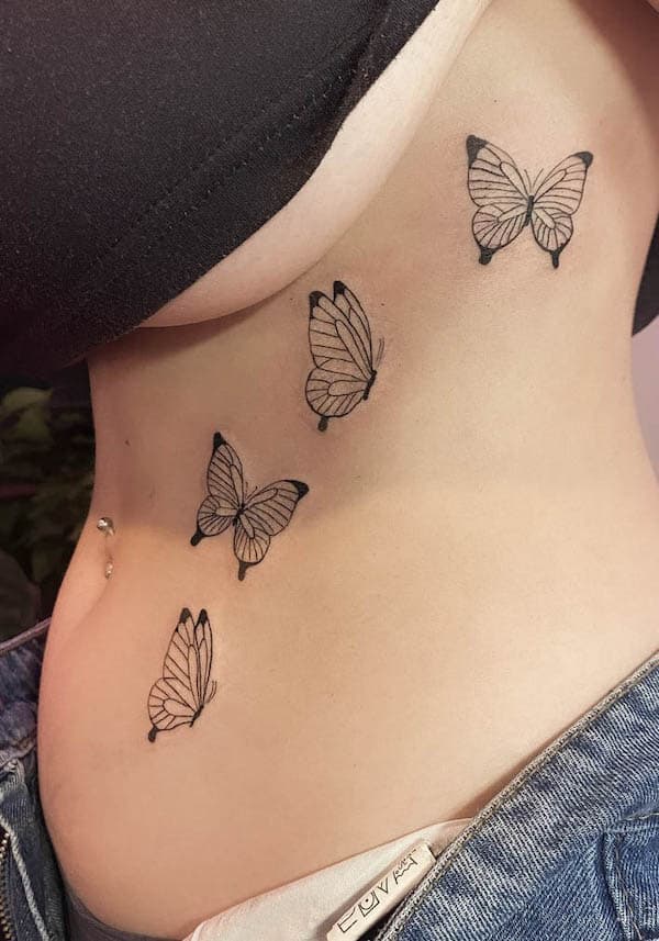 Butterfly waist tattoo by @triggerhappytattoos