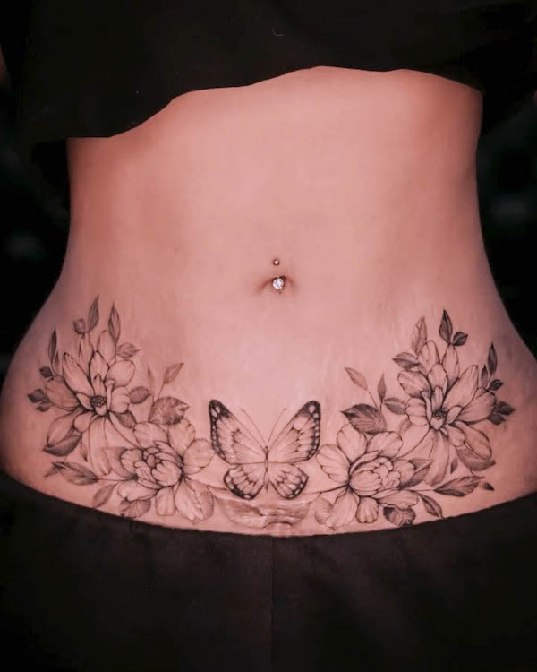 Cover-up butterfly tummy tuck tattoo by @inkbygrettel