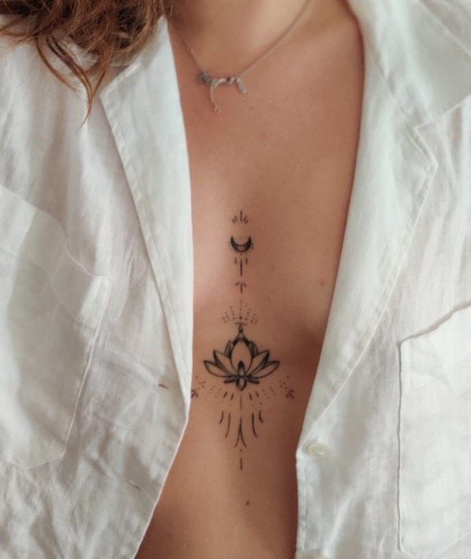 Delicate chest tattoo