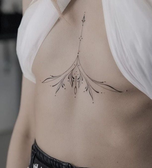 Delicate sternum tattoo woman botanical singleneedle