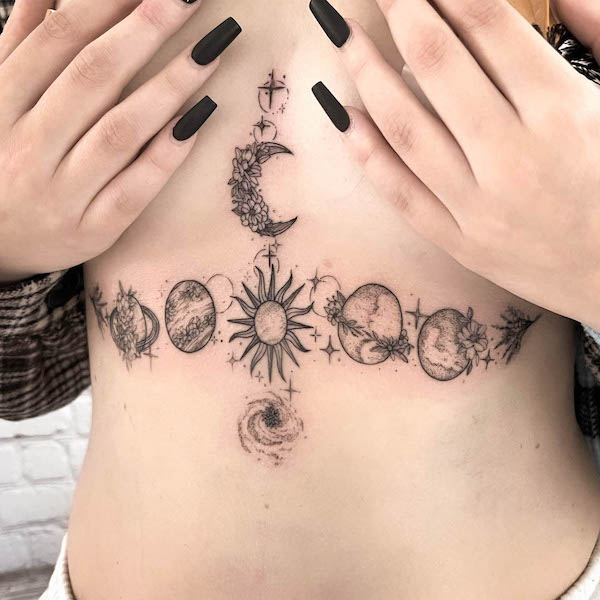 Intricate floral planets underboob tattoo by @_saskia.klotz_