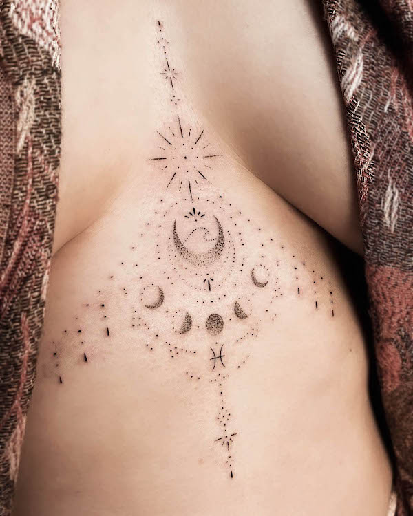 Intricate zodiac underboob tattoo by @lunae.magic