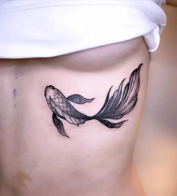 Koi fish underboob tattoo by @ariatattooing