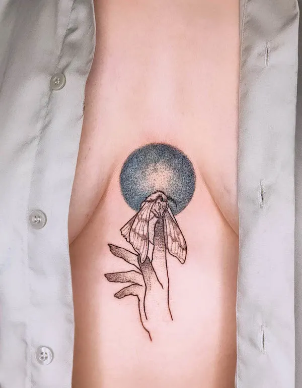 Moth and witchy hand underboob tattoo by @maziaje.tattoo