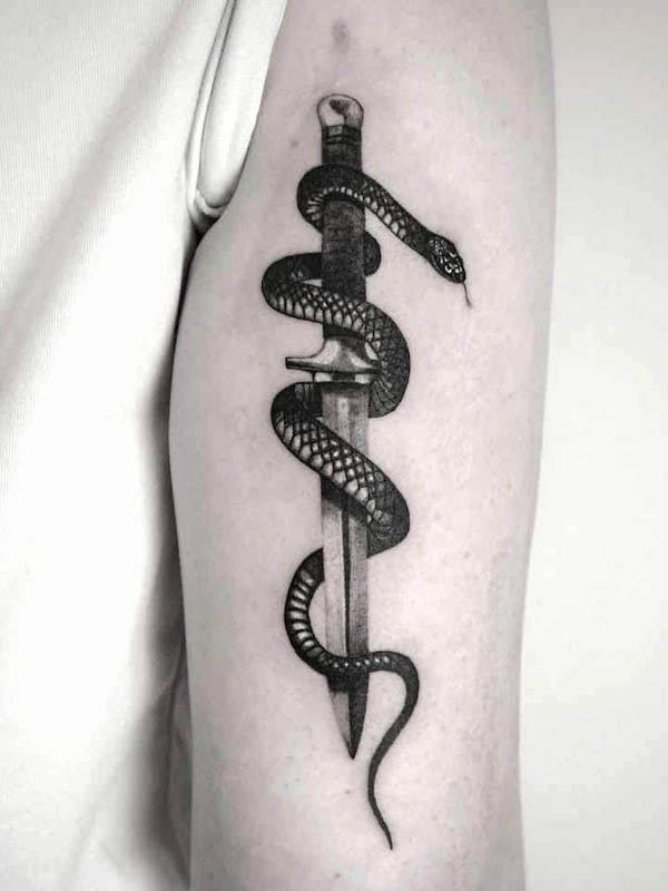 Realistic dagger and snake black tattoo by @wojtekrydlewski