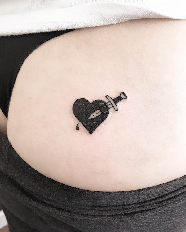 Small dagger through the heart tattoo by @oldfield_tattoo