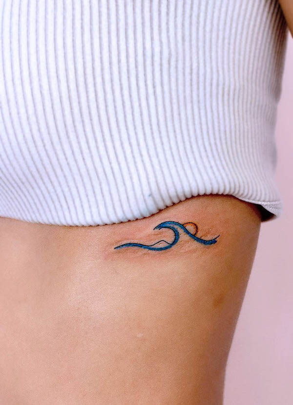 Small wave and sun rib tattoo by @tattoo.joojoo