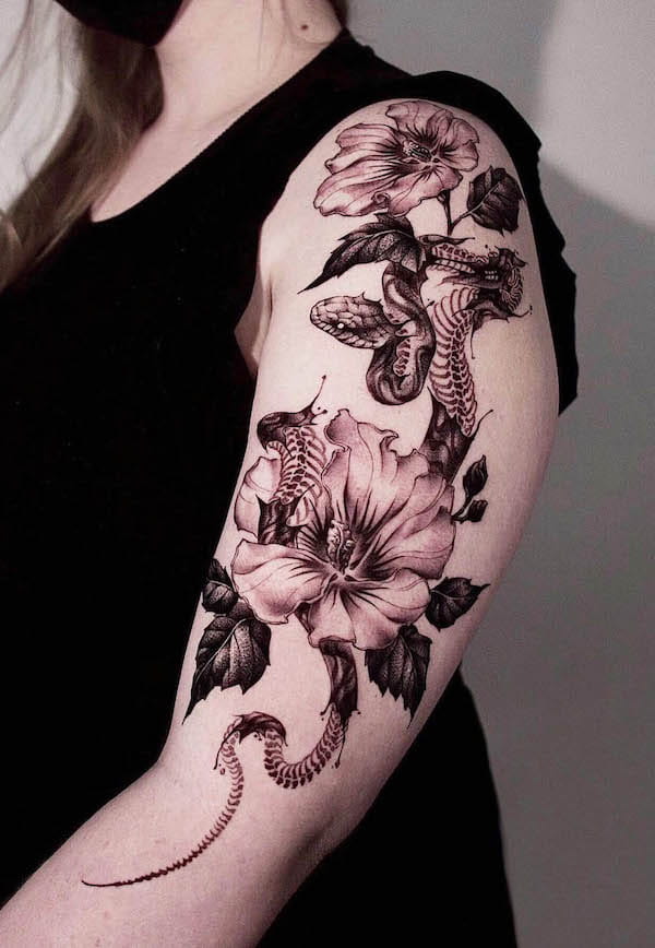 Snake and flowers half sleeve tattoo by @taena.tattoo