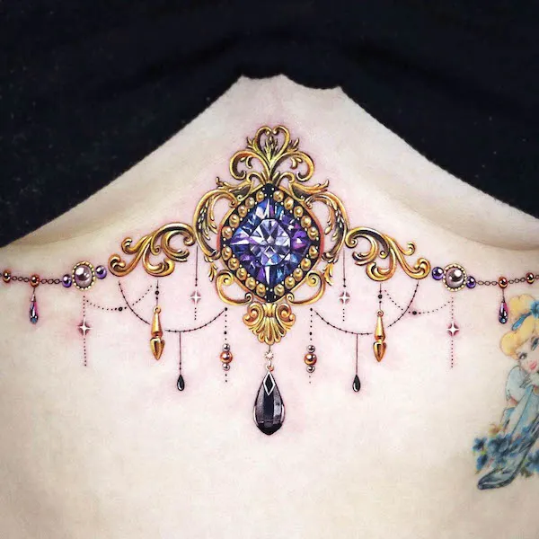 Stunning jewelry underboob tattoo by @jooa_tattoo