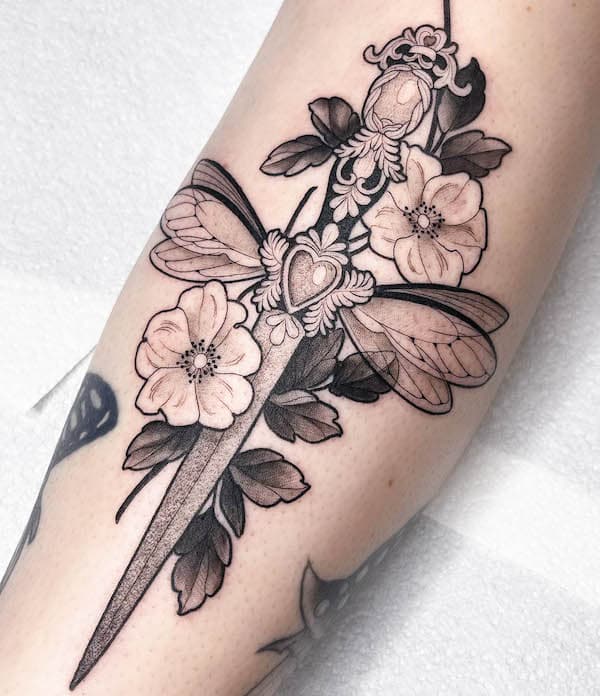 Traditional butterfly dagger tattoo by @macytattoos