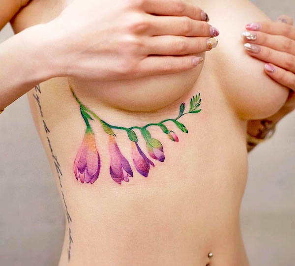 Unique flower underboob tattoo by @newtattoo_qiqi