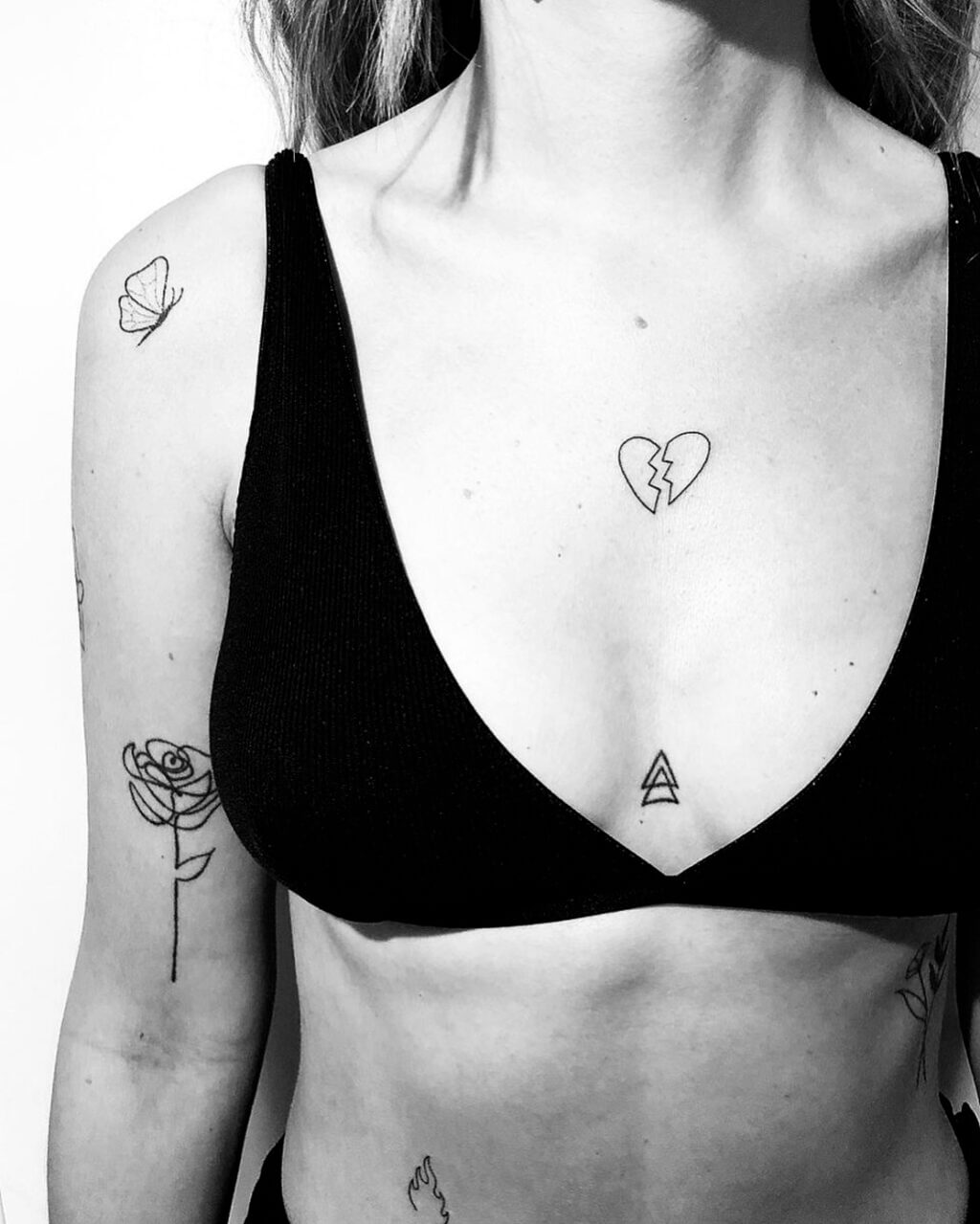 unique small female chest tattoos