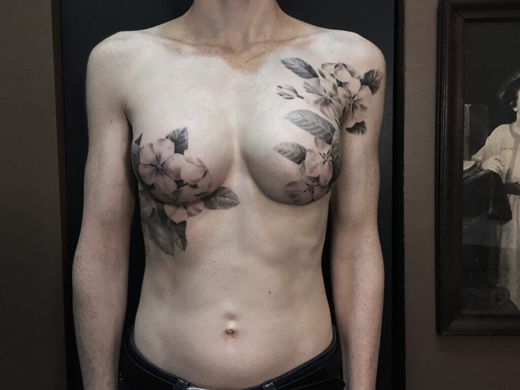 unique small female chest tattoos