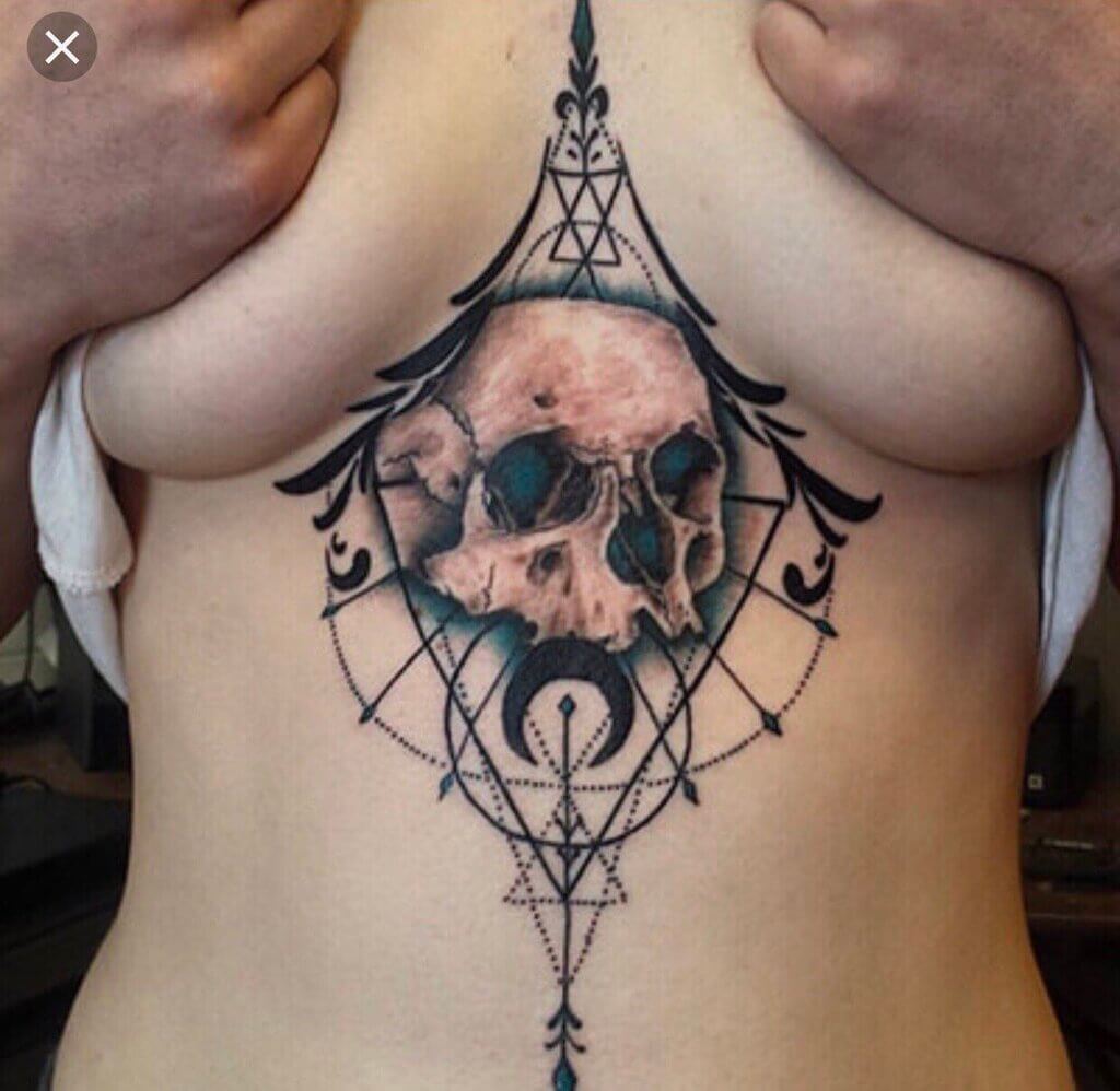 upper breast tattoo