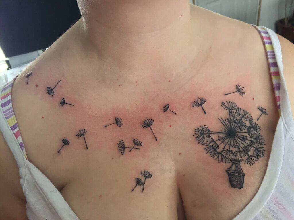 upper breast tattoo