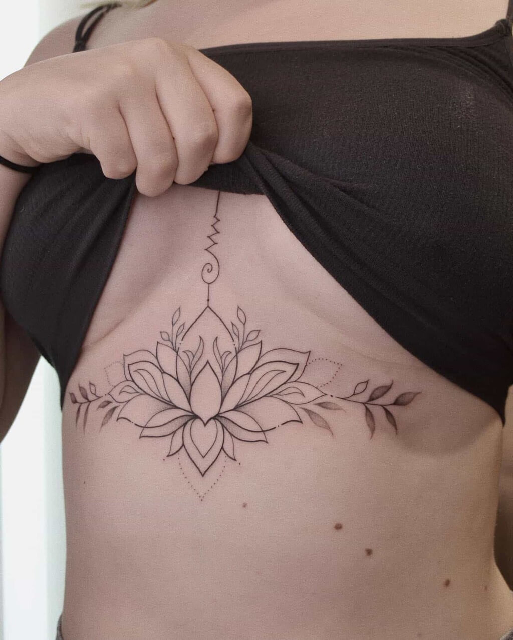 upper breast tattoo