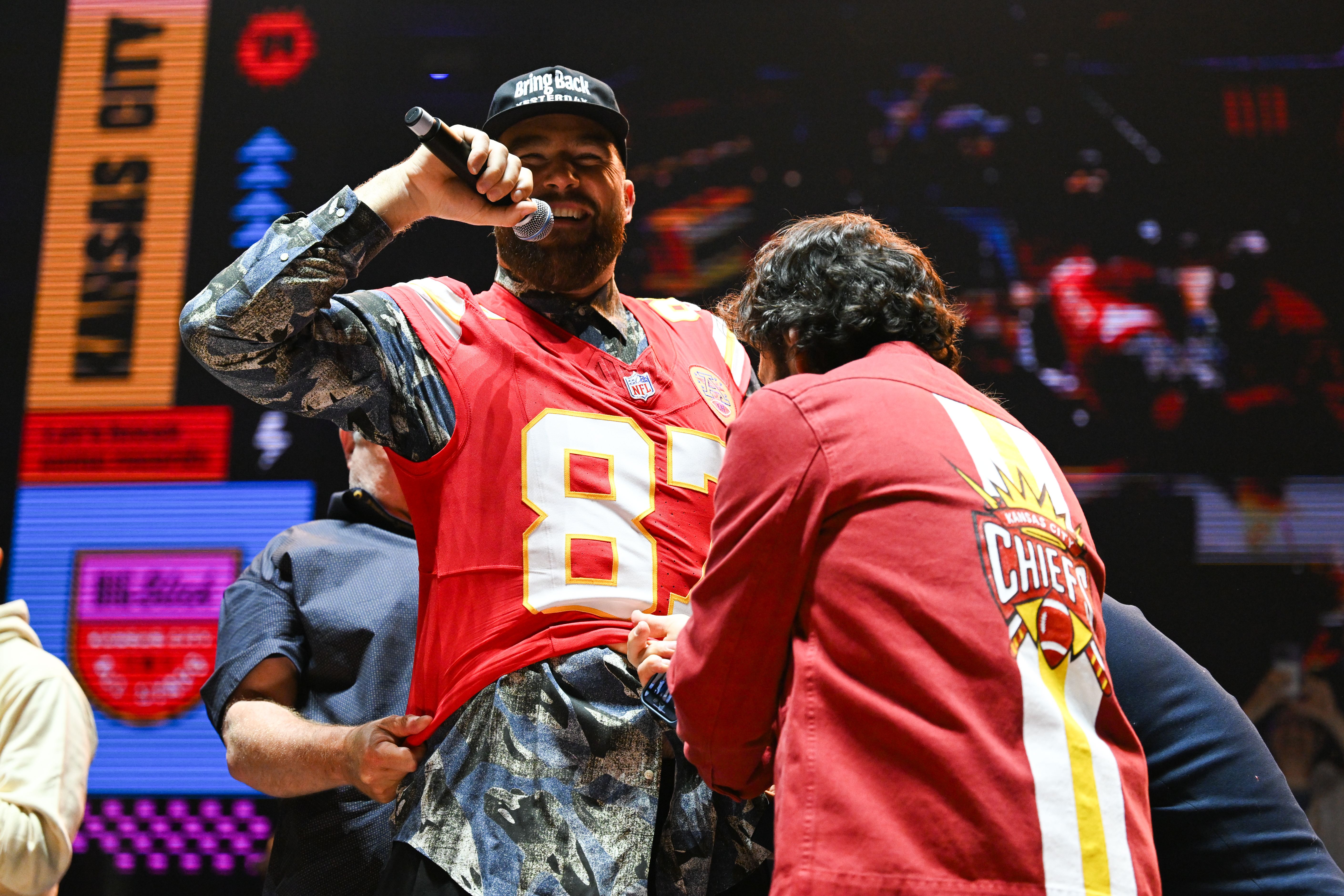 Travis Kelce and Paul Rudd on stage