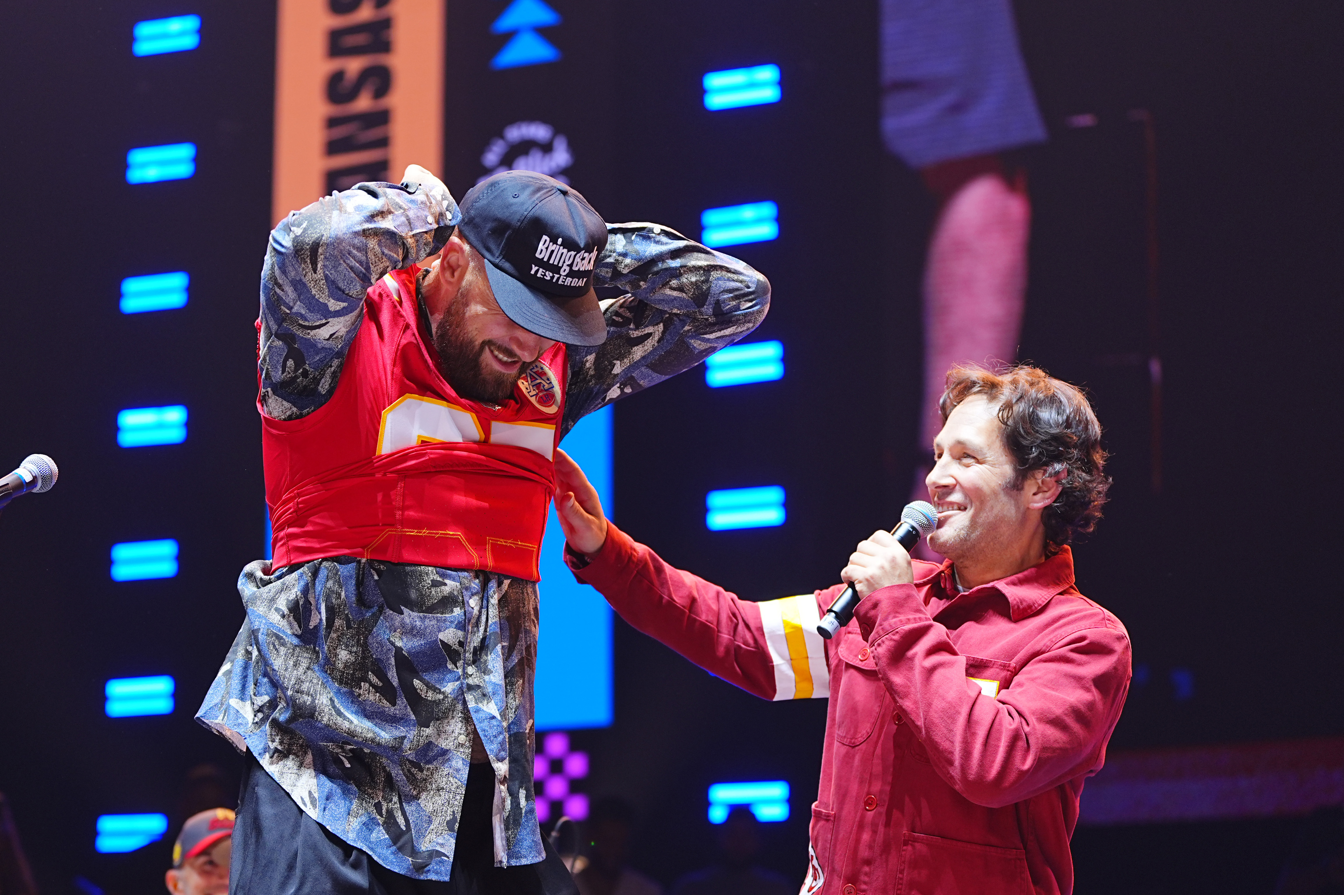 Travis Kelce and Paul Rudd on stage together