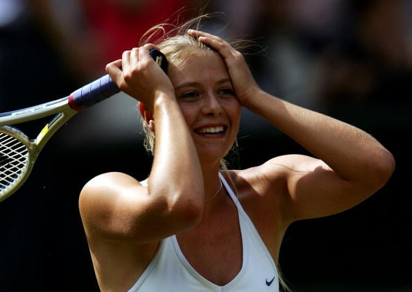 Maria Sharapova celebrates after she won her semi final match against Lindsay Davenport in Wimbledon 2004. (Photo by Mike Hewitt/Getty Images)