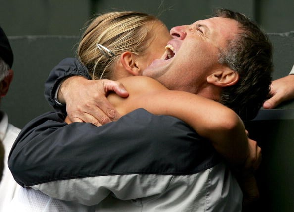 Maria Sharapova hugs her father Yuri as she celebrating winning the ladies final match against Serena Williams at the Wimbledon Lawn Tennis Championship on July 3, 2004. (Photo by Clive Brunskill/Getty Images)